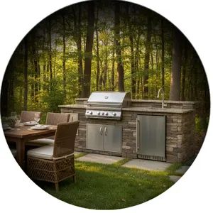 Outdoor stone kitchen with stainless steel grill and drawers under wooden pergola with string lights in backyard icon
